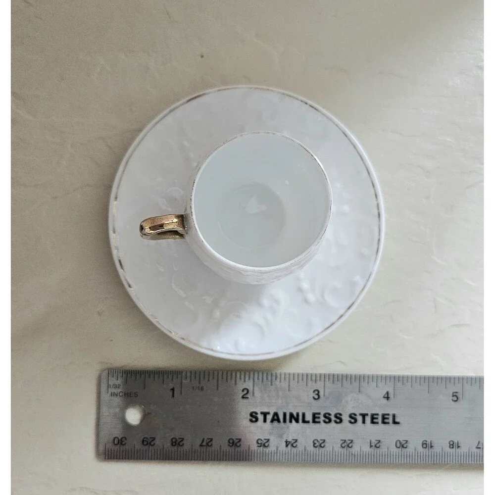 Vintage Miniature White Raised Design Cup And Saucer